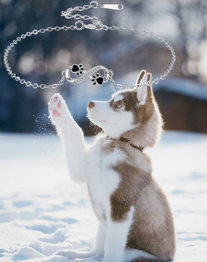 Bransoletka z symbolem nieskończoności i wisiorkiem w kształcie łapki z cyrkoniami